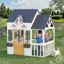 EROMMY Outdoor Play House for Kids, Elevated Roof Wooden Kids Playhouse with Kitchen Toys, Blackboard,Magnetic Door, Flowerpot Holders, Pet Hole, Clock,Black and White